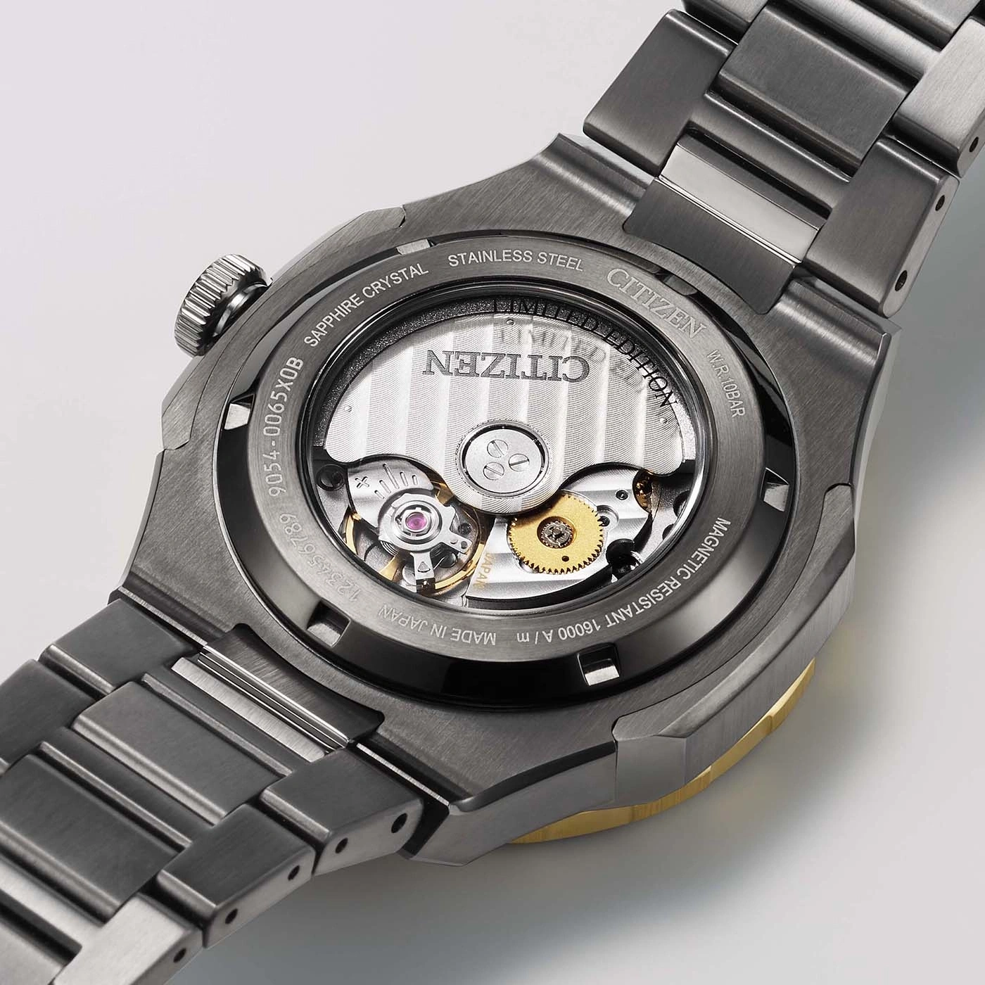 Close-up of a Citizen watch with a visible mechanism and stainless steel bracelet.