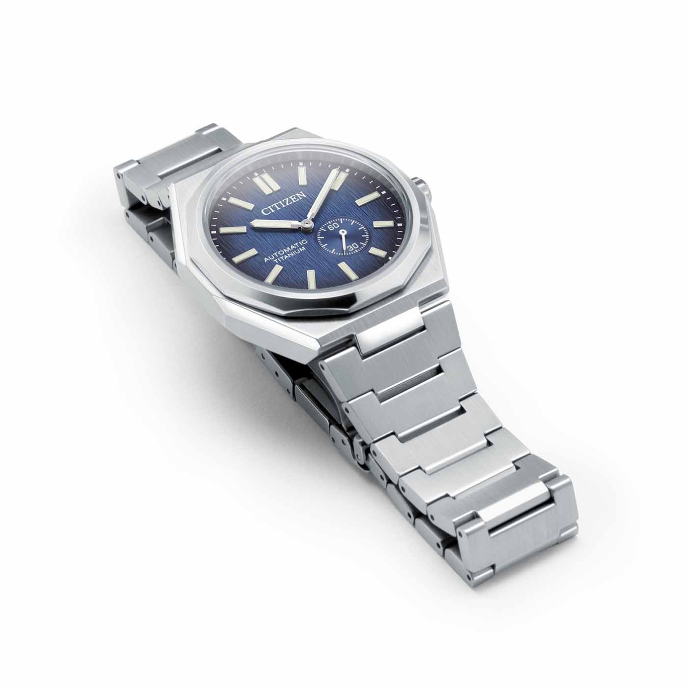 Citizen watch with blue face and silver strap on white background