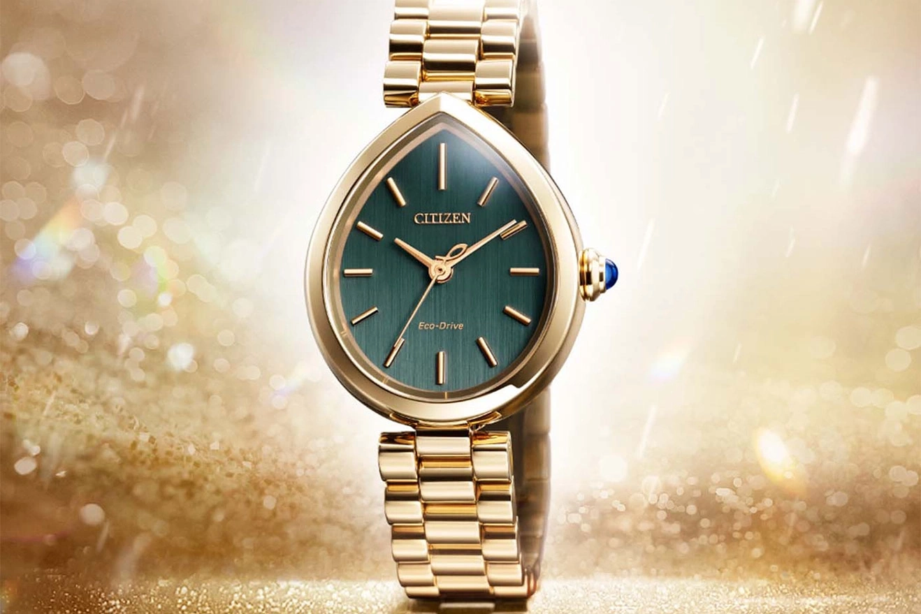 Elegant gold Citizen Eco-Drive watch with a green dial and teardrop case.