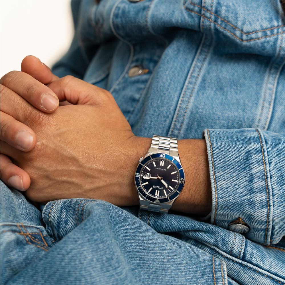 Man wearing a denim jacket and a Citizen watch