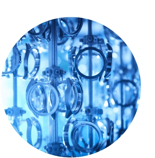 Close-up of watch parts, blue-toned, industrial, circular, metal, manufacturing process