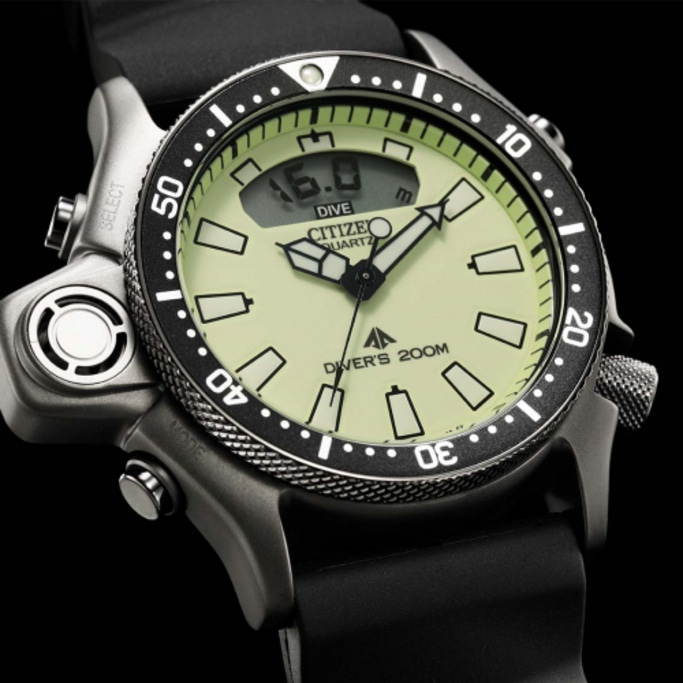 Citizen dive watch with black bezel and digital display, showing depth.