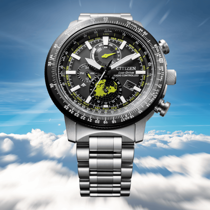 Citizen Eco-Drive watch with multiple dials and a world map on a cloudy background.