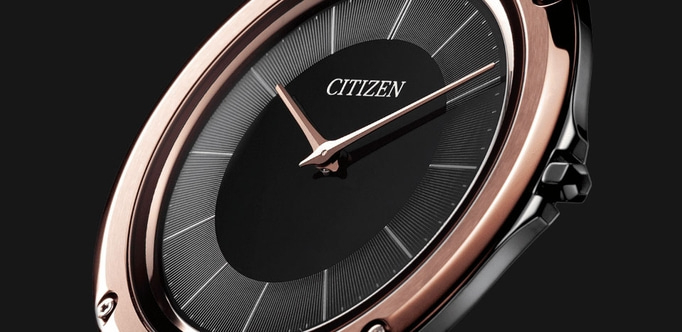 Close-up of a Citizen watch with a black face and rose gold accents.