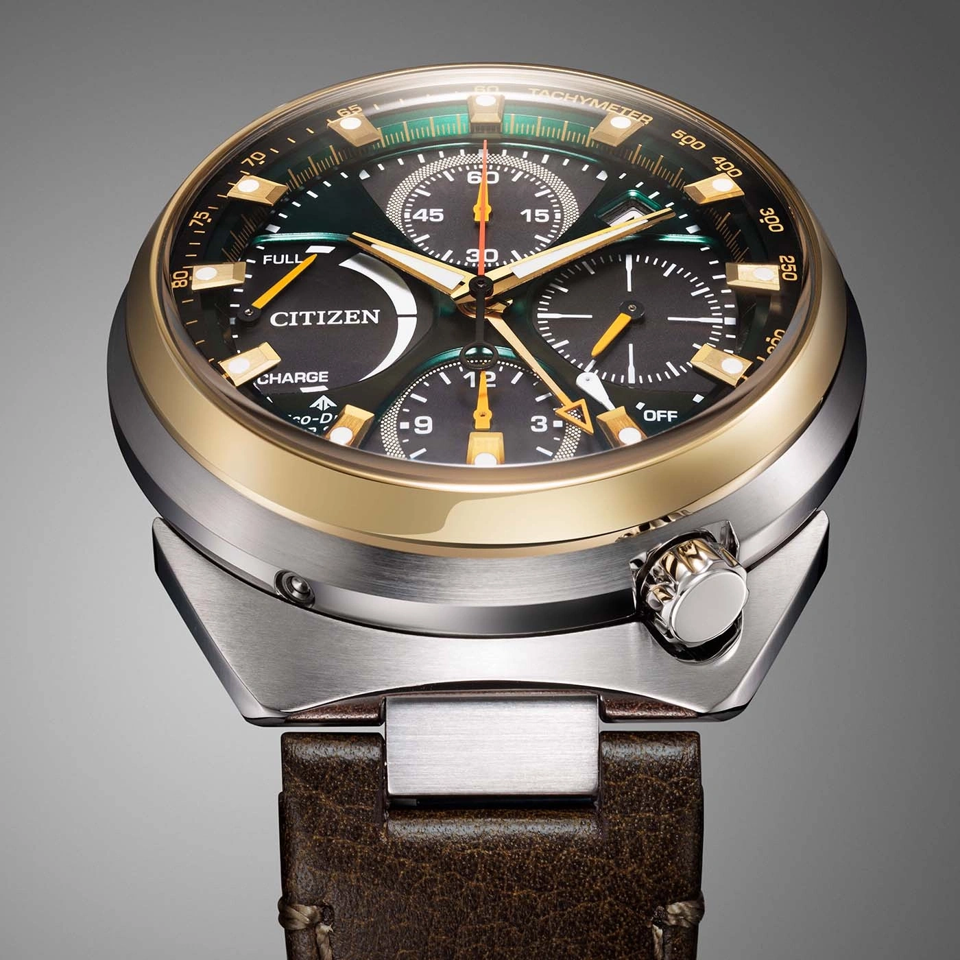 Close-up of a Citizen Eco-Drive chronograph watch with a dark green dial and gold accents.