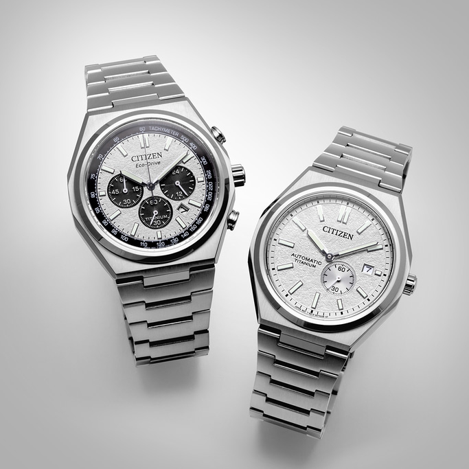 Two Citizen watches, silver, titanium, Eco-Drive and Automatic, on a white background.