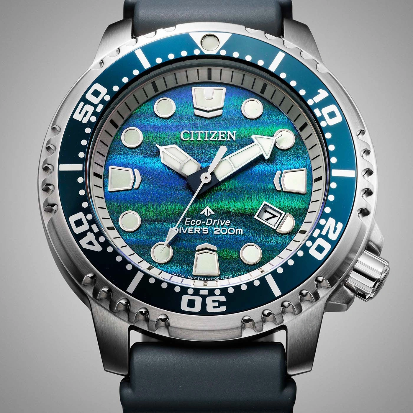 A close-up shot of a Citizen Eco-Drive divers watch with a blue and green dial.