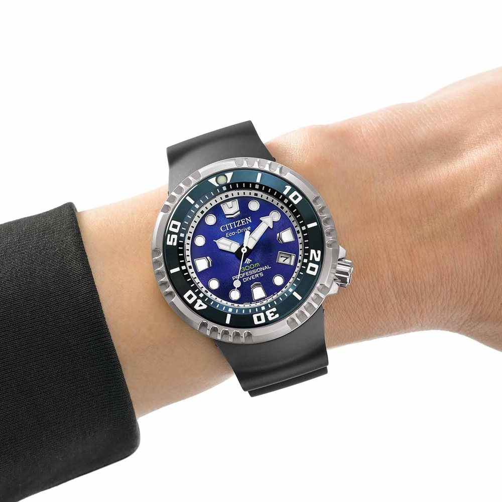Citizen Eco-Drive watch on wrist, blue dial, black strap, professional diver's watch