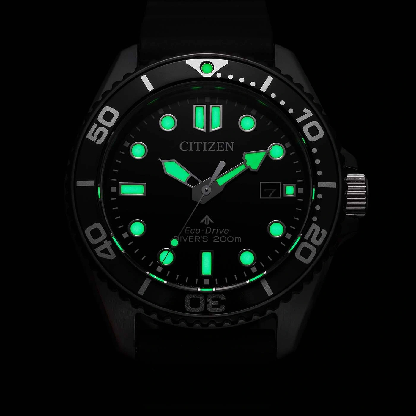 Black Citizen Eco-Drive diver's watch with luminous green markers.