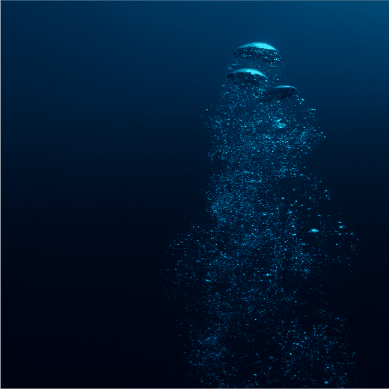 Bubbles rising in deep blue water, underwater scene, ocean