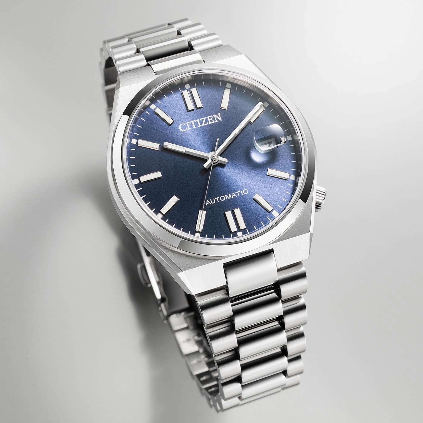 Citizen automatic watch with a blue dial and silver bracelet.