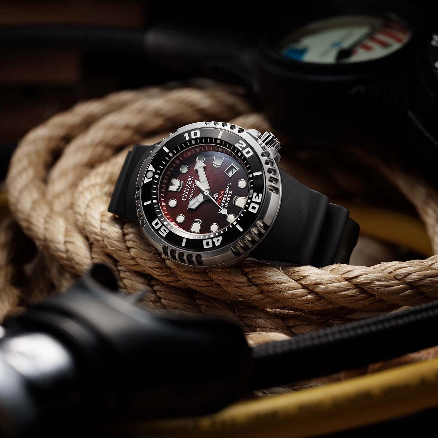 Citizen watch on rope, professional diver's watch, black strap, red dial, close-up