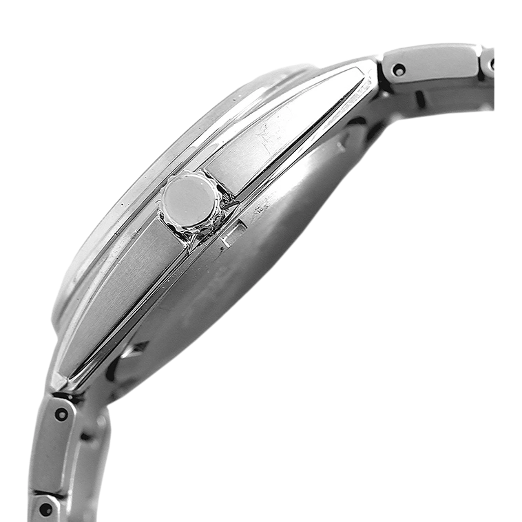 Close-up of a silver wristwatch with a round crown and metal band.