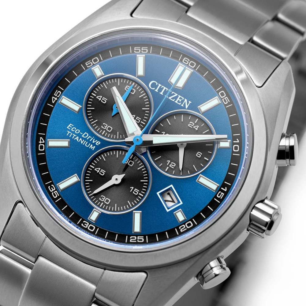 Close-up of a blue Citizen Eco-Drive Titanium watch face with chronograph dials.