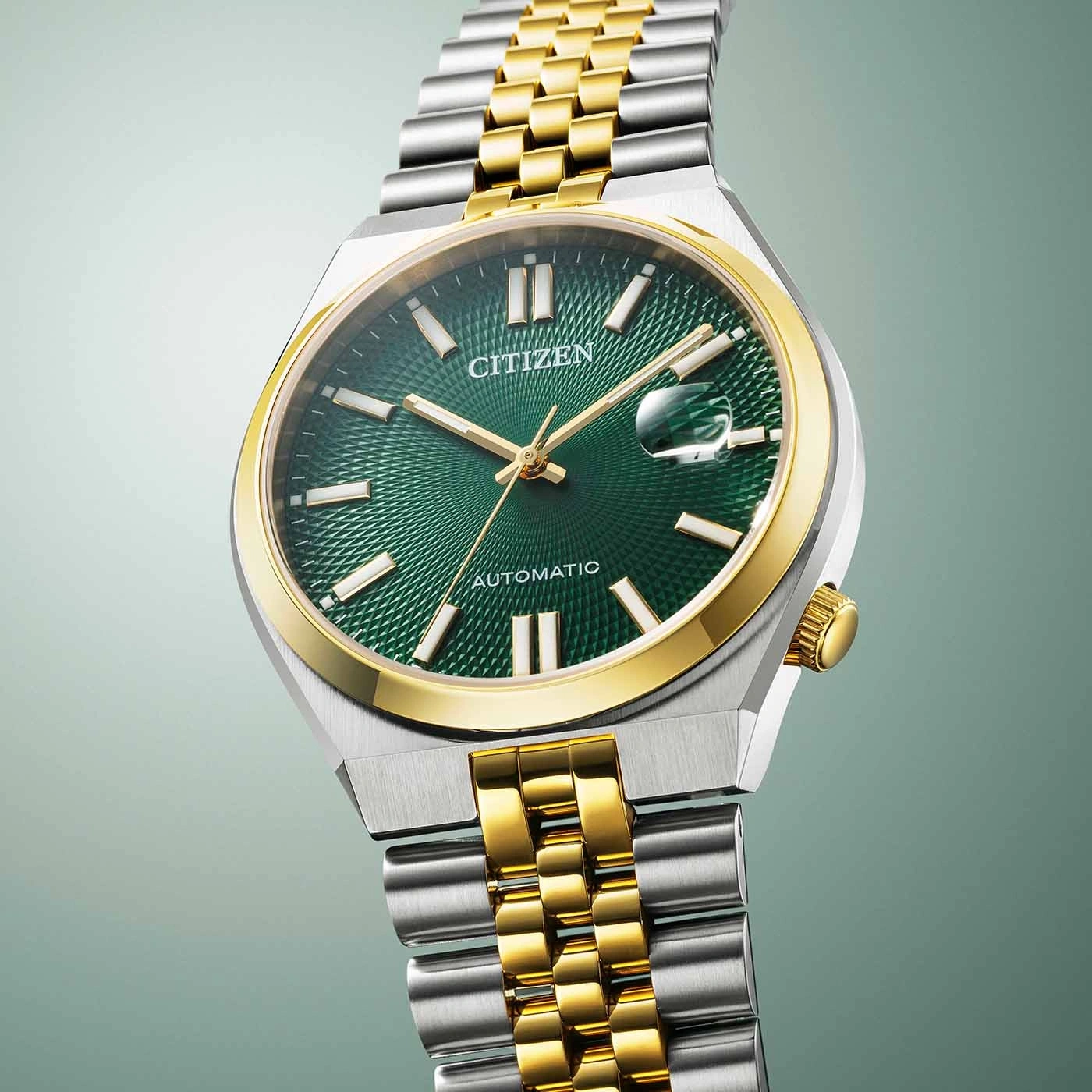 Citizen watch with green face and gold and silver band