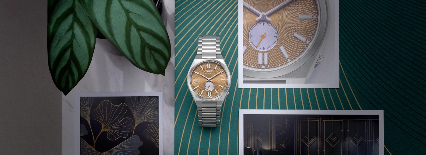 Watch on green background with leaves and art prints