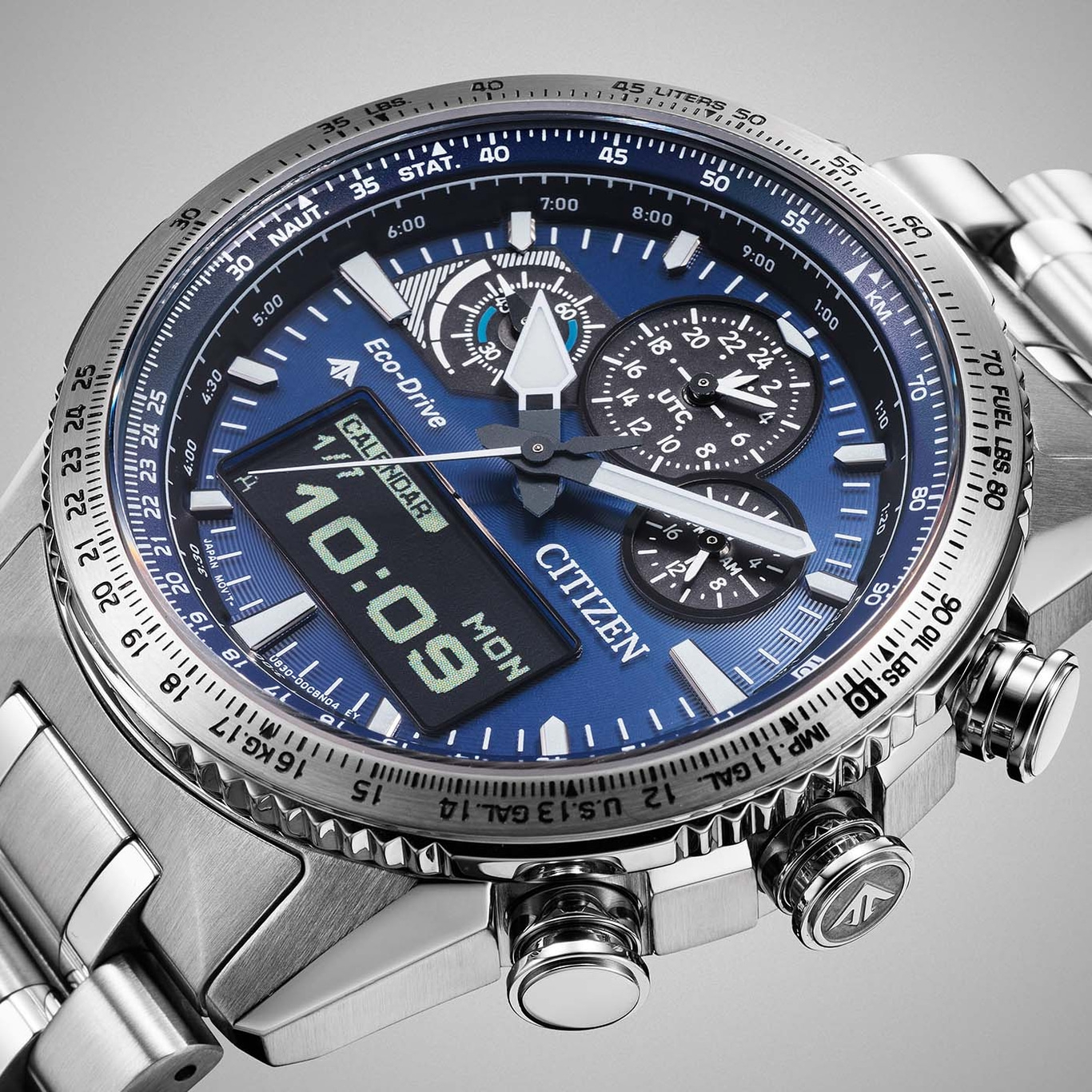 Citizen watch with blue face, digital display, and chronograph features, stainless steel.