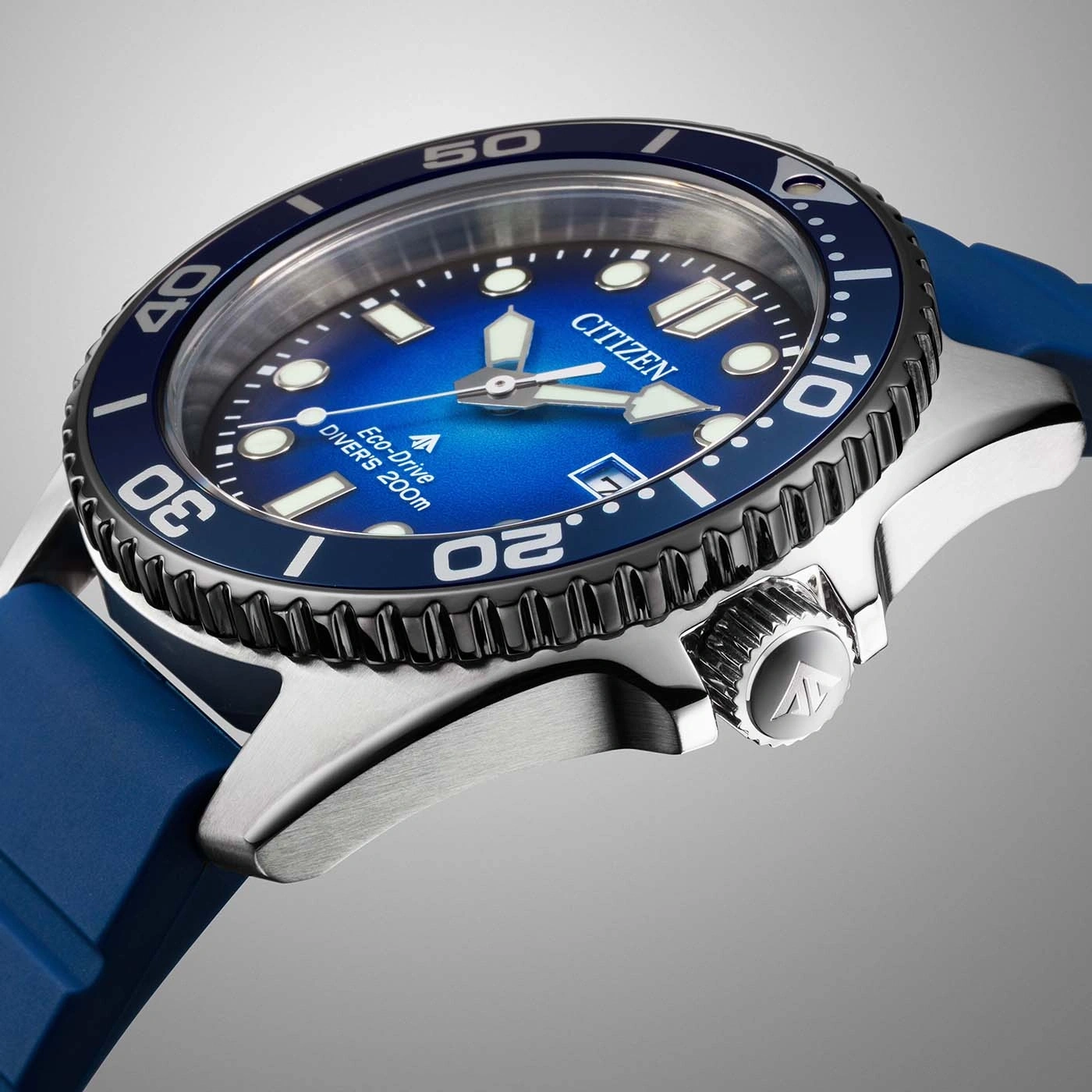 Close-up of a blue Citizen Eco-Drive diver's watch with a metal strap.