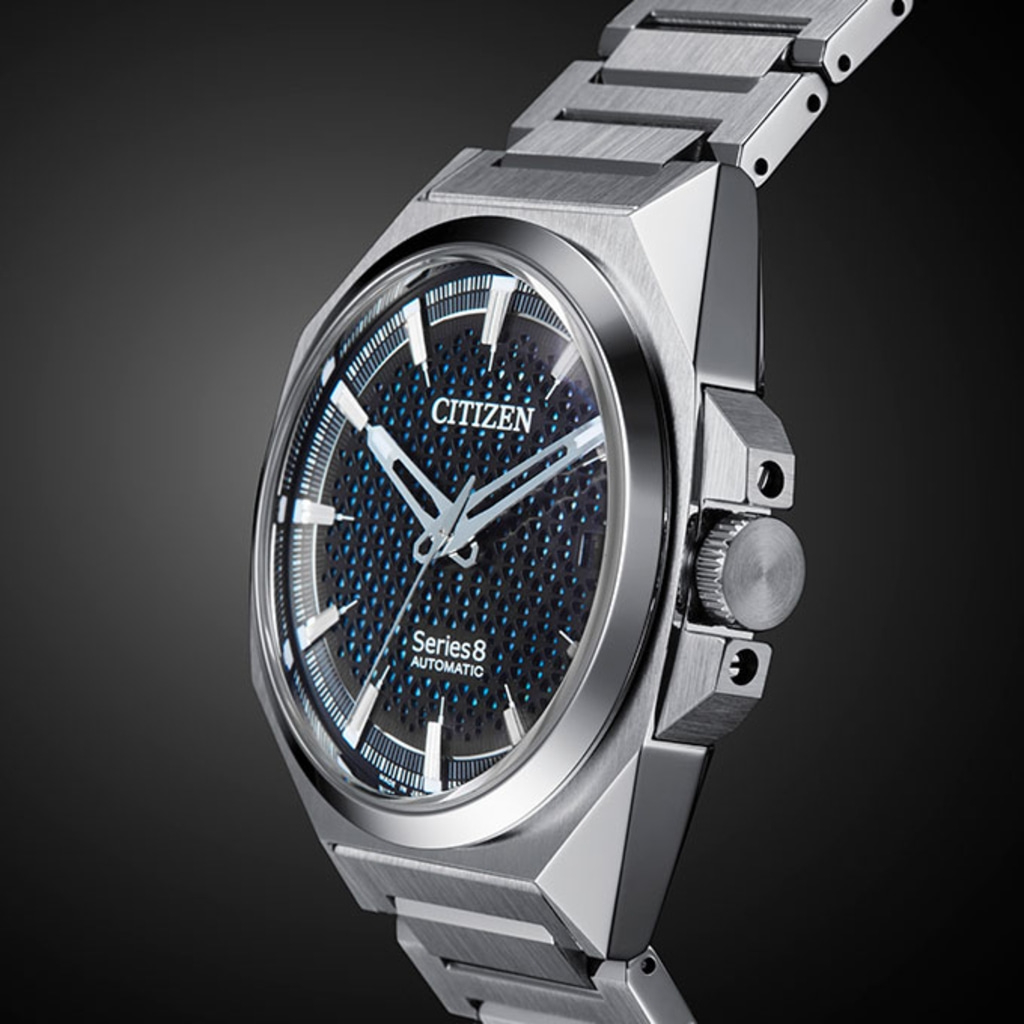 Citizen Series 8 automatic watch with a black and blue dial and silver strap.