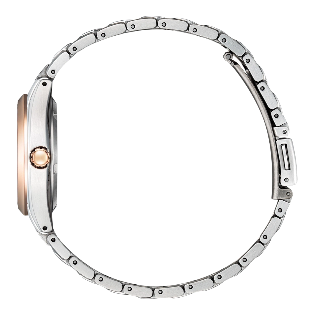 Side view of a silver watch with a rose gold bezel and band.