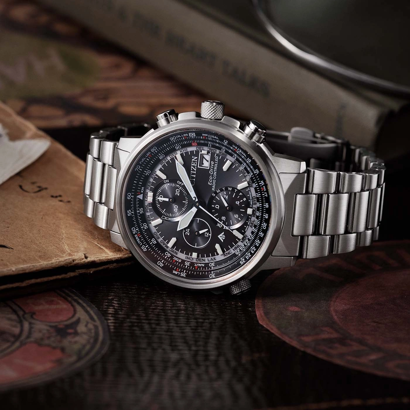 Citizen watch with black face, silver band, and detailed chronograph features.