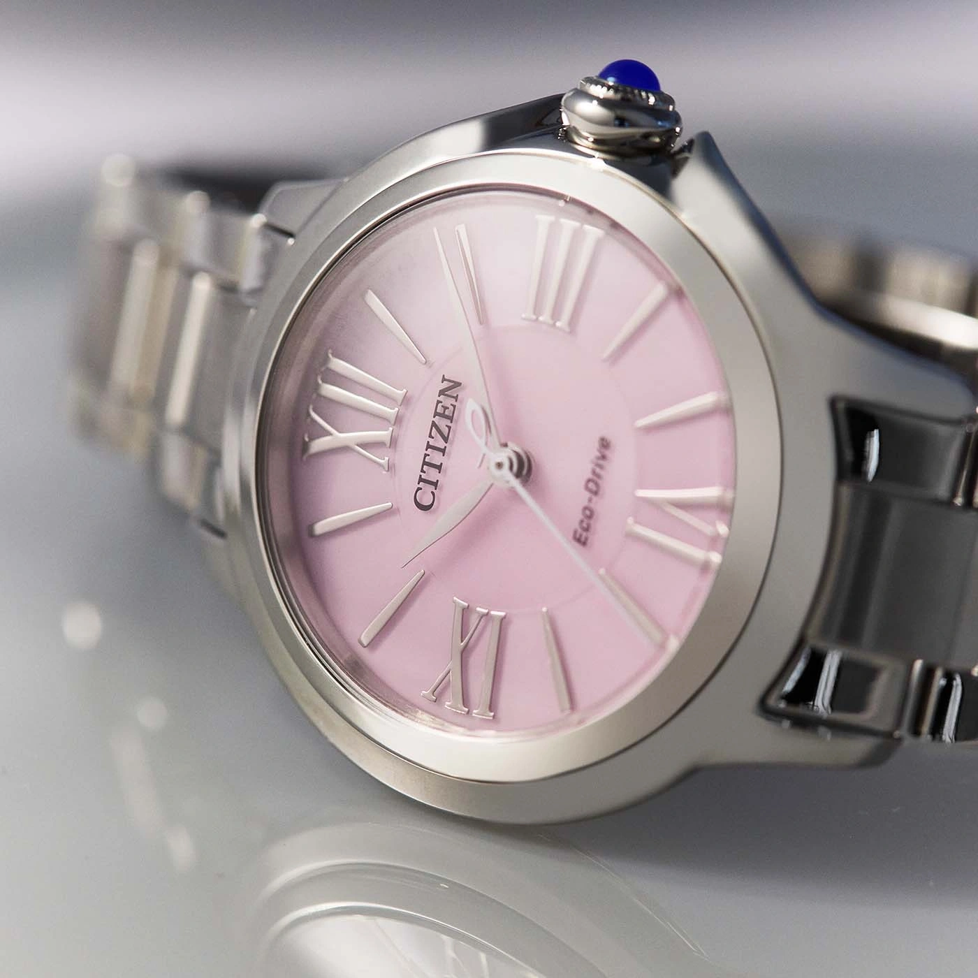 Citizen watch with pink face and silver band, Roman numerals, Eco-Drive.