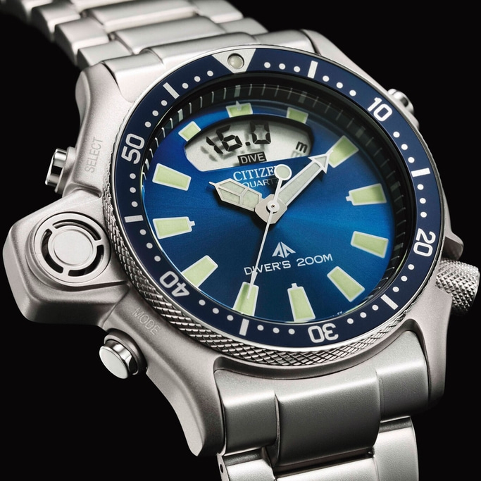 Close-up of a Citizen dive watch with a blue face and silver band.