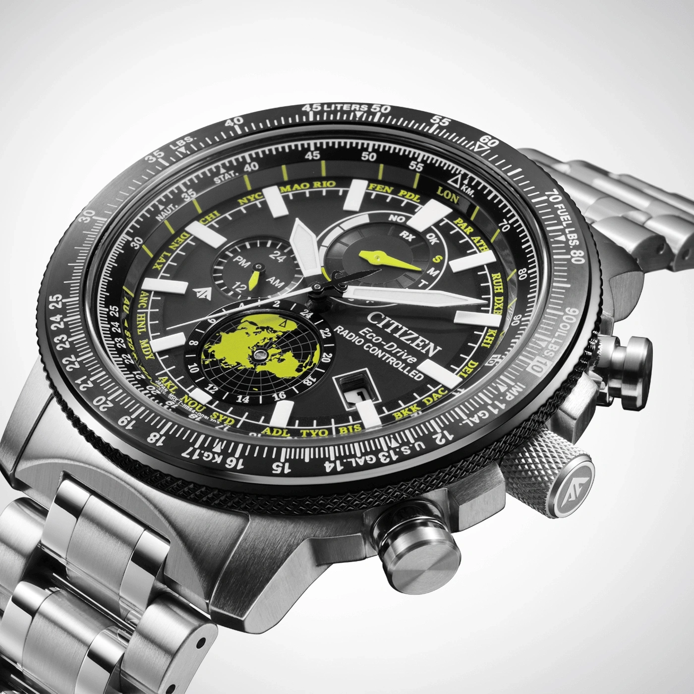Citizen Eco-Drive watch with black face, world map, and silver band.