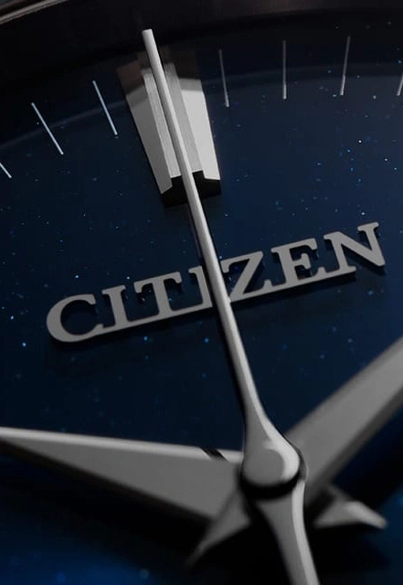 Close-up of a Citizen watch face with hands and the brand name.