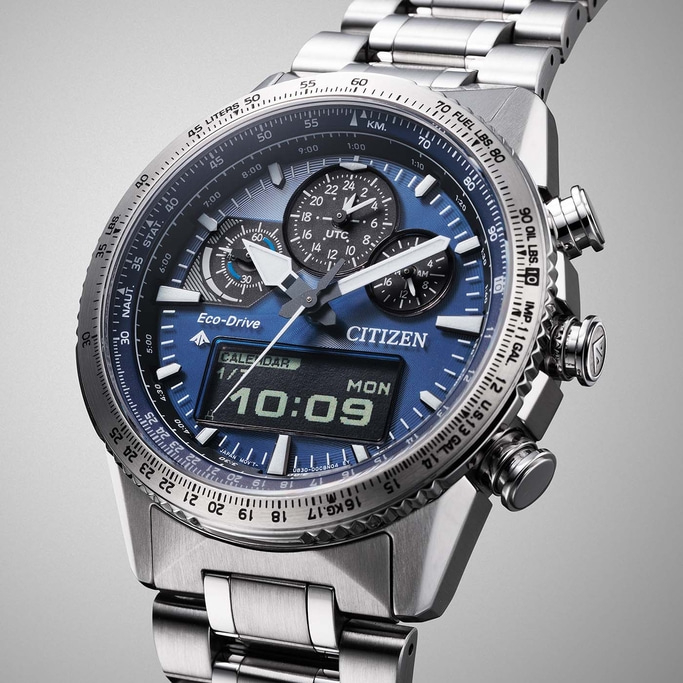 Citizen watch with blue face, chronograph, and digital display showing time and date.