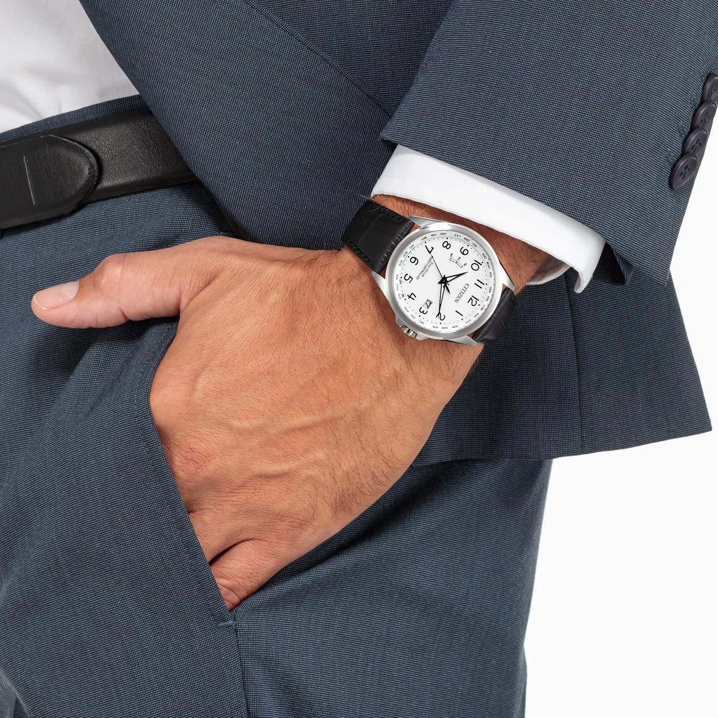 Man in suit with watch, hand in pocket, formal attire, business