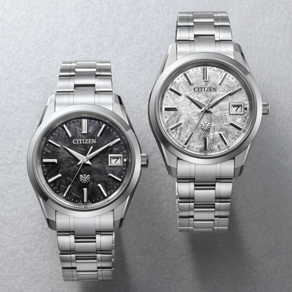 Two Citizen watches with textured dials and stainless steel bracelets.