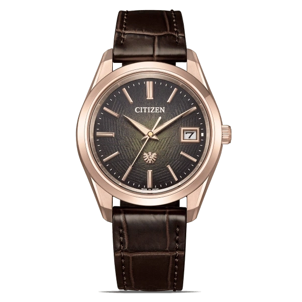 Citizen watch with a brown leather strap and a dark face with a date display.