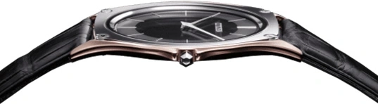 Elegant watch with black leather strap and a dark face, close-up shot.