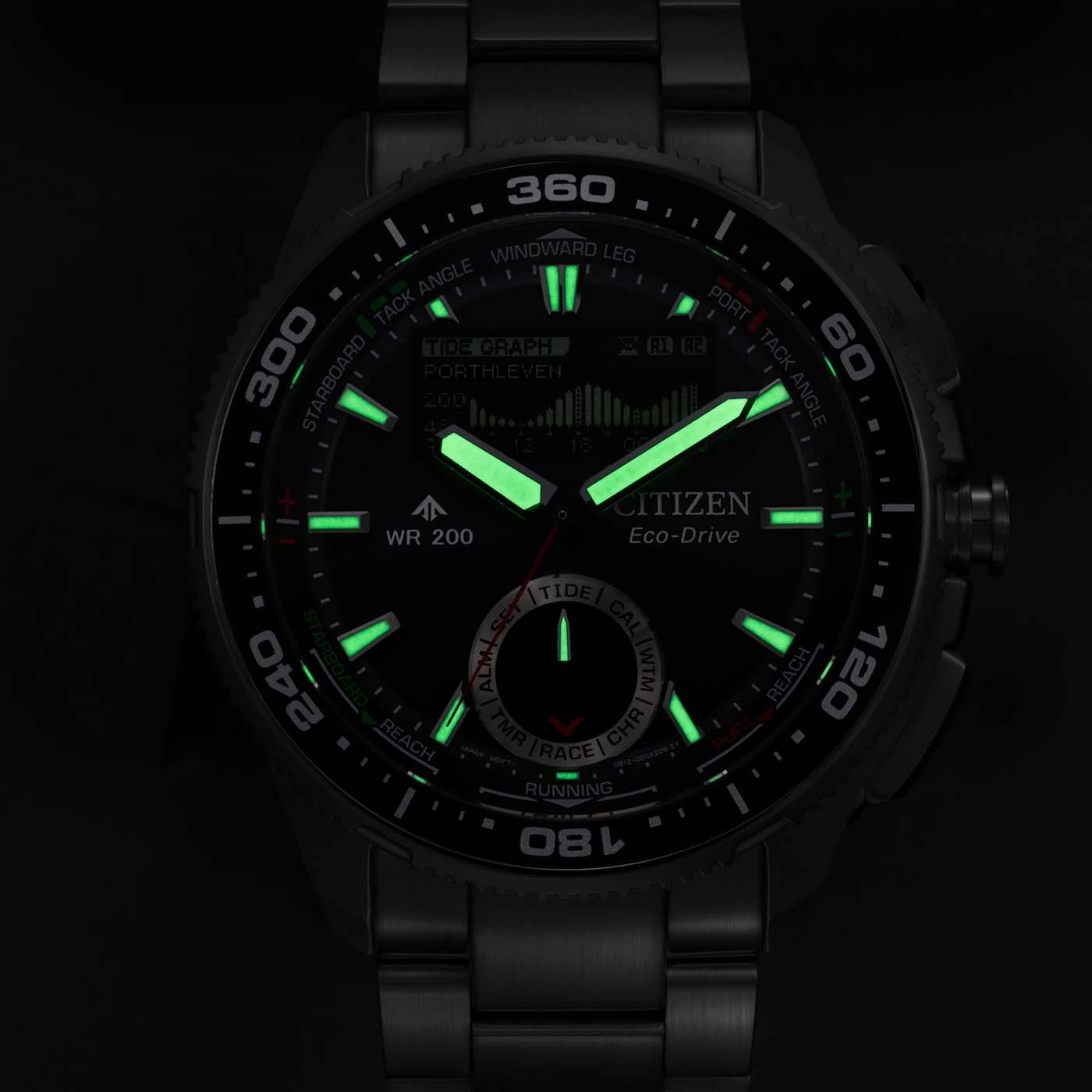 A dark Citizen Eco-Drive watch with glowing green hands and markers on a black background.