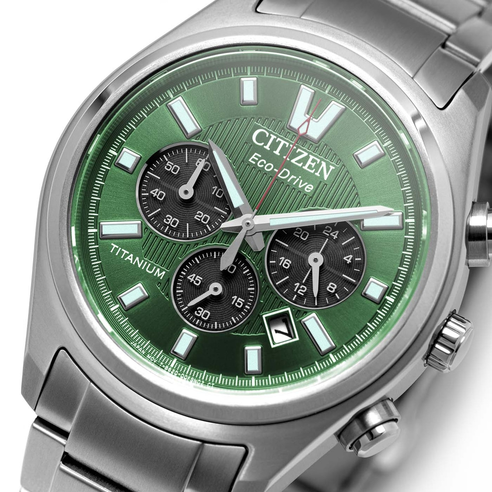 Close-up of a green Citizen Eco-Drive watch with silver band.