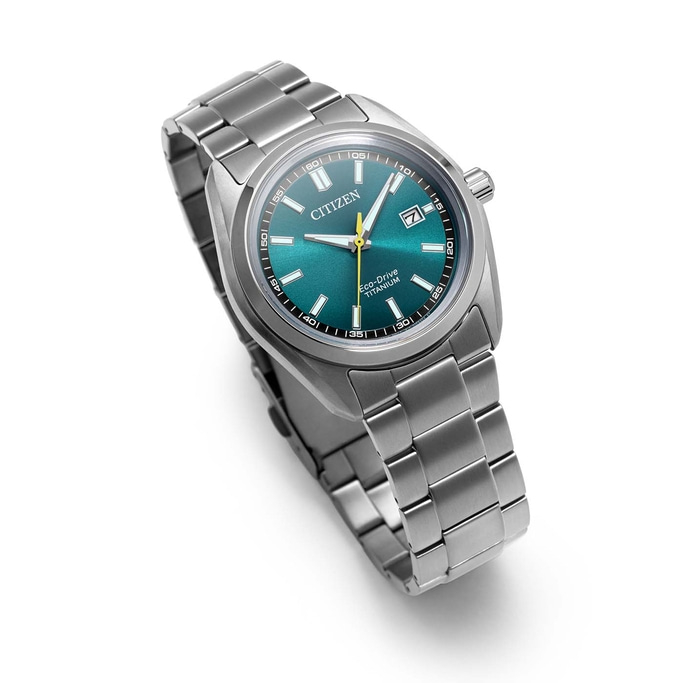 A modern Citizen Eco-Drive titanium watch with a green dial.
