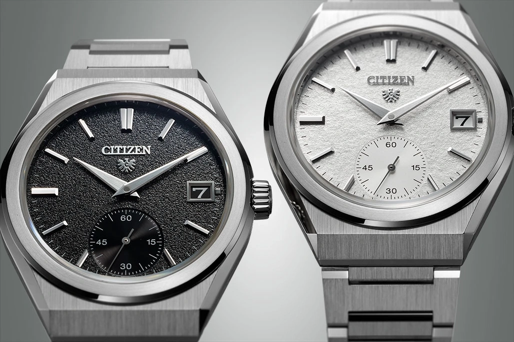 Two Citizen watches with textured dials and date displays, elegant design.