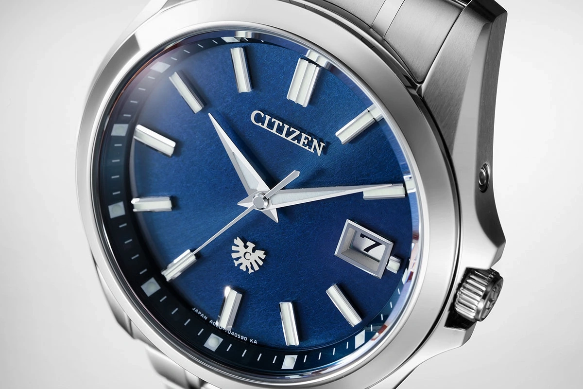 Close-up of a Citizen watch with a blue dial and silver accents.