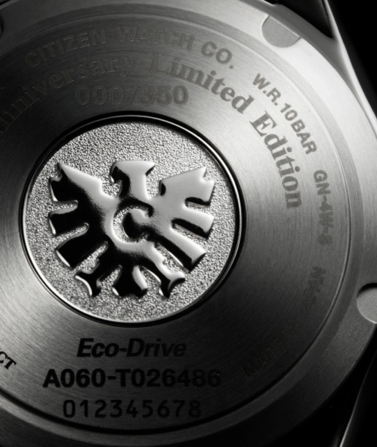 Close-up of a Citizen watch back with text and logo, Eco-Drive.