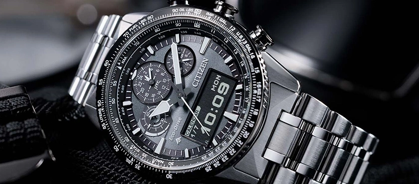 Close-up of a Citizen watch with a detailed dial and metal band, showing time.