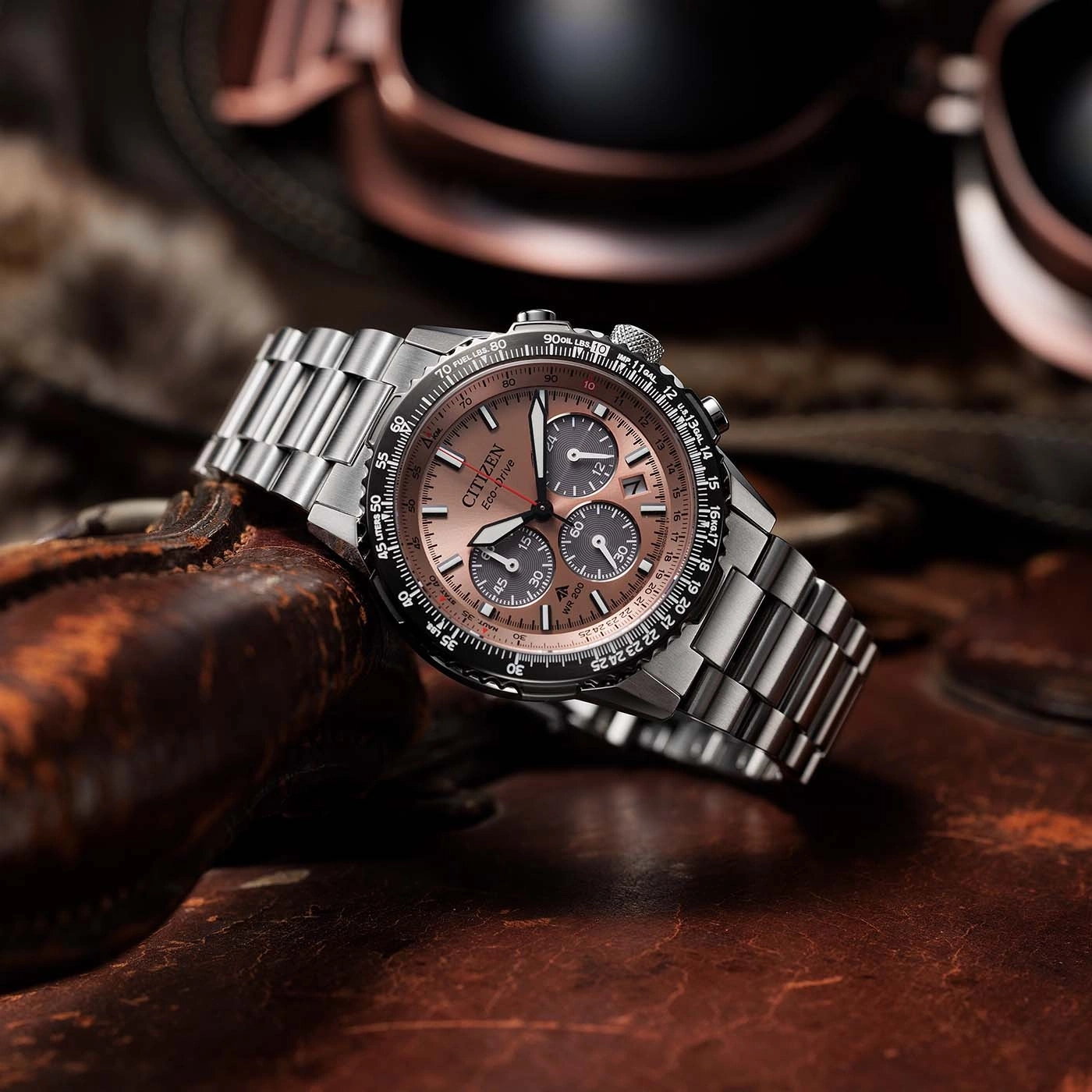 Close-up of a Citizen Eco-Drive watch on a leather surface.