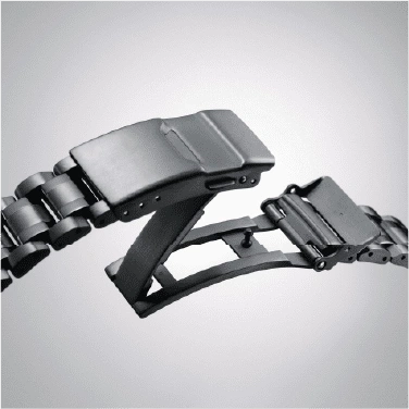 Close-up of a black watch strap clasp, open and ready to close.