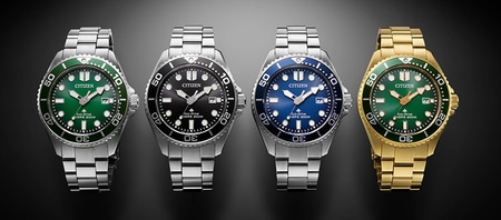 Vier Citizen Eco-Drive Taucheruhren in Silber und Gold mit Farbvarianten.