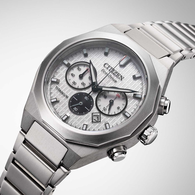 Citizen Eco-Drive titanium watch with chronograph and date display, silver dial.