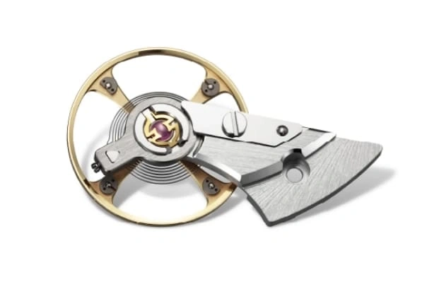 Close-up of a watch escapement mechanism with intricate details and design.