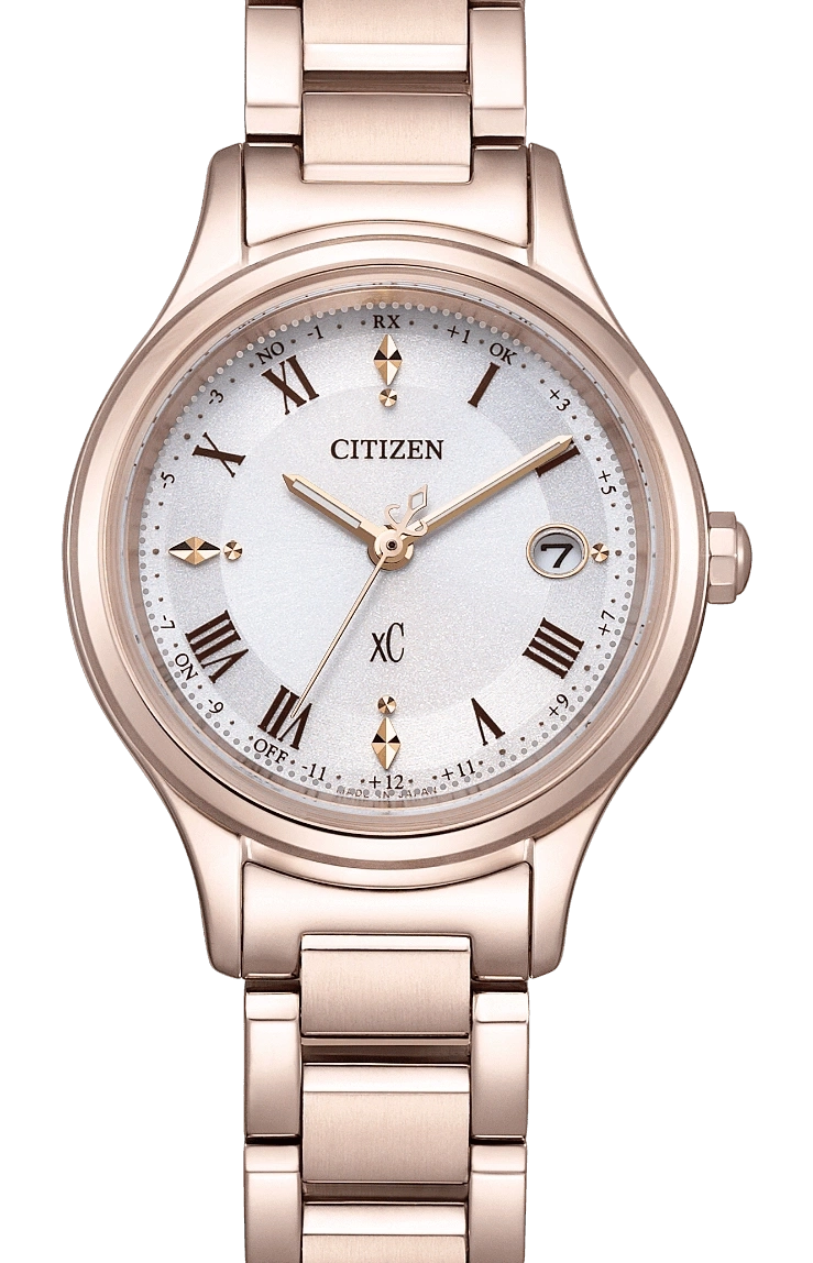 Citizen XC watch with rose gold band and white face, date display.