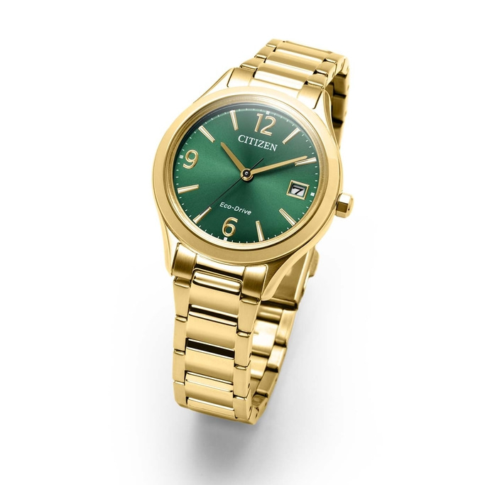 A gold Citizen Eco-Drive watch with a green dial.