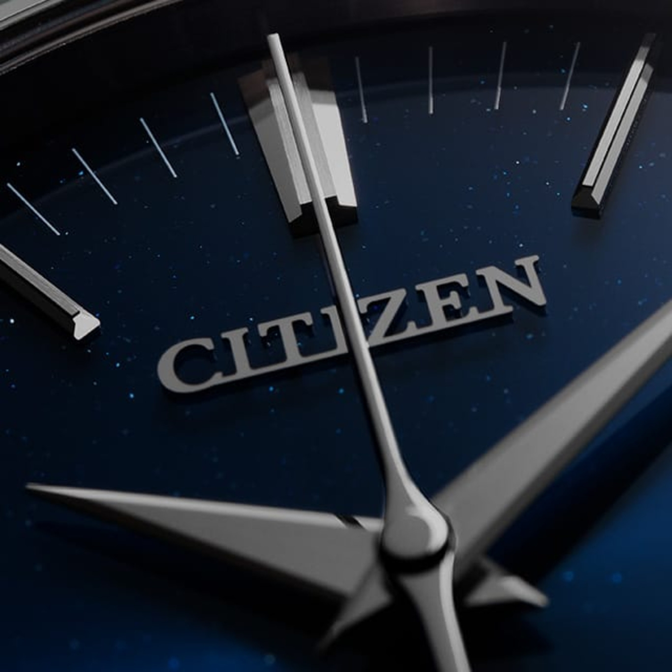 Close-up of a Citizen watch face with hands and logo on a blue background.