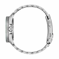 Side view of a silver watch with a green bezel and metal band.